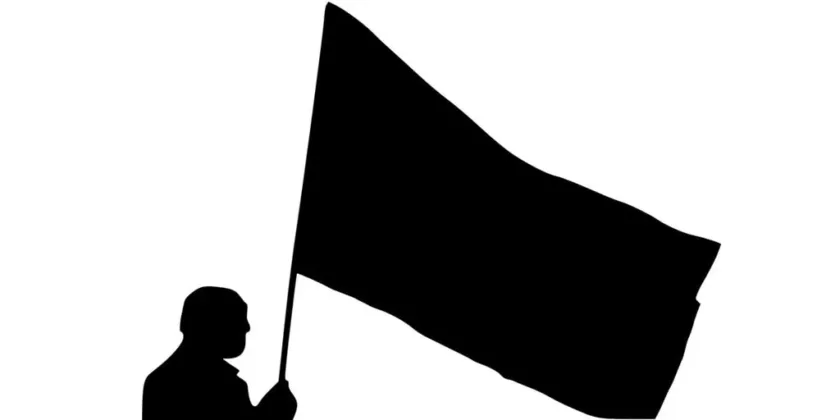 Man with flag - silhouette